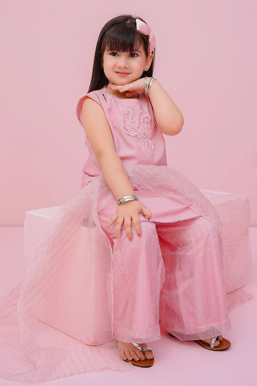 Little girl in pink embroidered top and sparkly tulle pants, perfect for kids' fashion and special occasions.