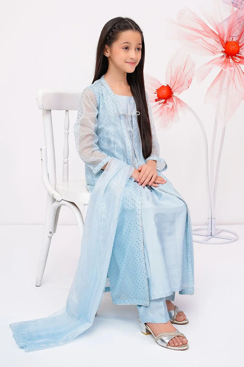 Girl in light blue polka dot kids fashion outfit with sheer dupatta, sitting on white chair