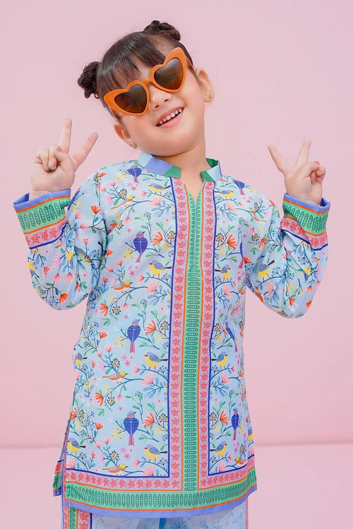 Girl in colorful bird-print kurta with heart sunglasses, making peace signs