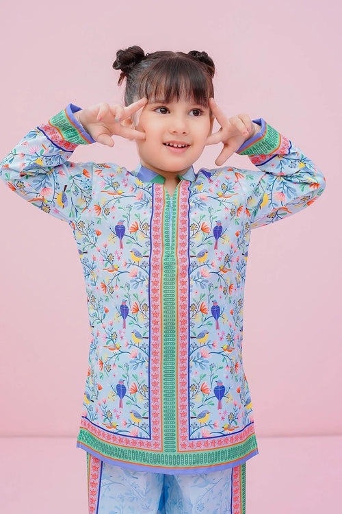 Cute girl in colorful bird-print kids kurta set, playful pose, trendy children's fashion