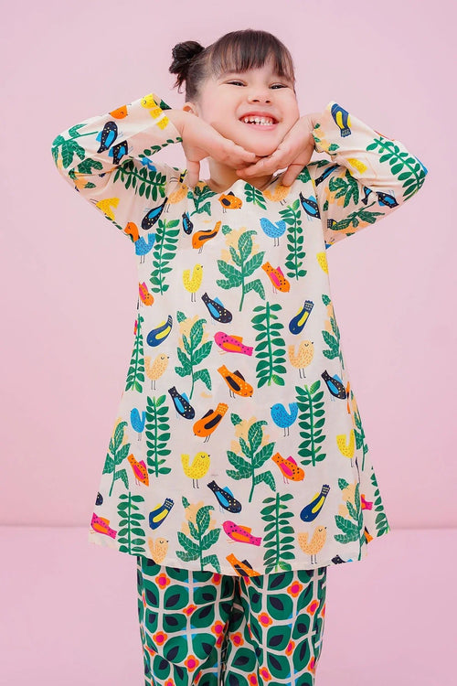 Happy girl in colorful bird and leaf print kids pajama set, shop trendy children's sleepwear