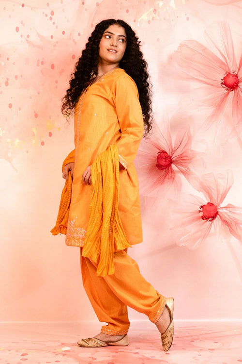 Orange embroidered kurta set with palazzo pants, perfect for festive occasions and casual wear