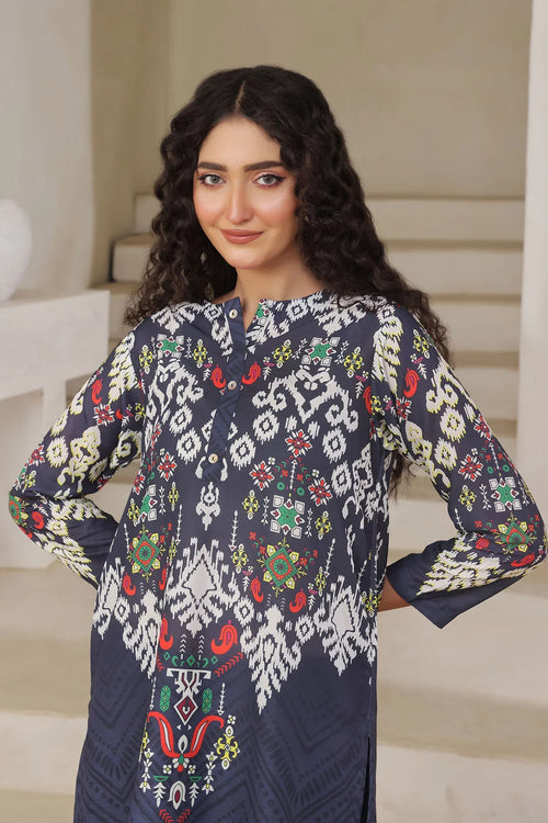 Woman wearing navy blue printed kurta with colorful geometric patterns, stylish ethnic wear for women