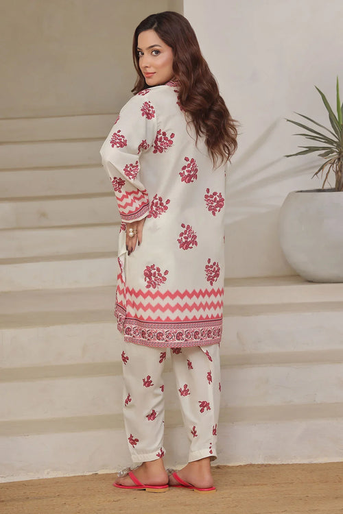 White floral printed kurta with pink zigzag hem and matching pants, stylish women's ethnic wear