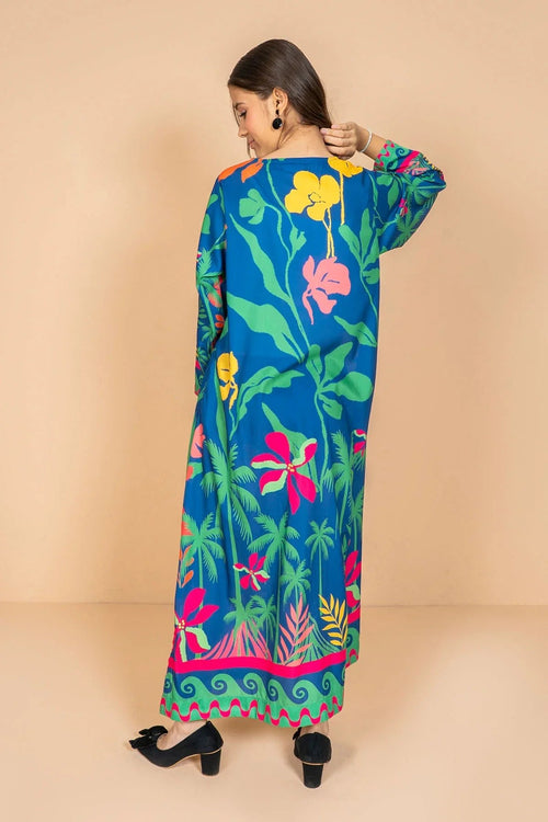 Vibrant tropical print long dress with floral and palm leaf patterns, perfect for women's fashion.