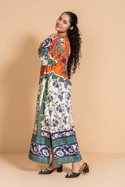 Woman in colorful floral print maxi dress with long sleeves, perfect for trendy women's fashion